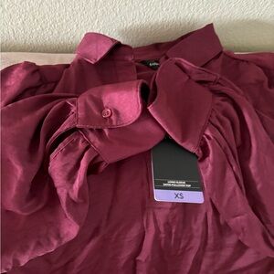 Beautiful brand new with a tag long sleeve satin pullover top